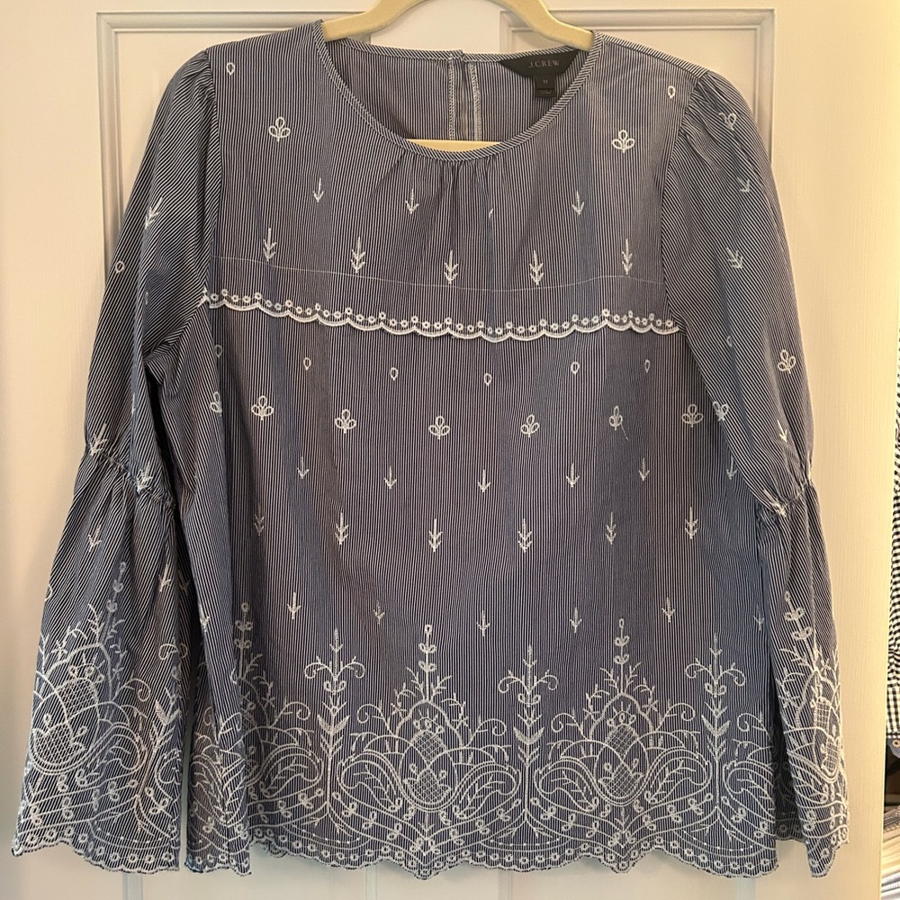 Jcrew navy and white stripe top with bell sleeve and embroidery.  Size M.